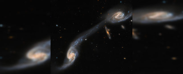 Хаббл обнаружил удивительную галактическую связь на расстоянии 200 миллионов световых лет